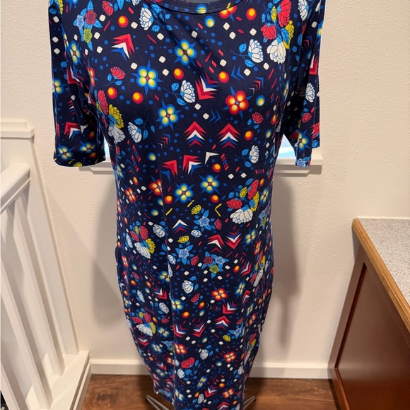 LuLaRoe Dresses & Skirts - LuLaRoe Carly Navy Floral & Colorful Print Top